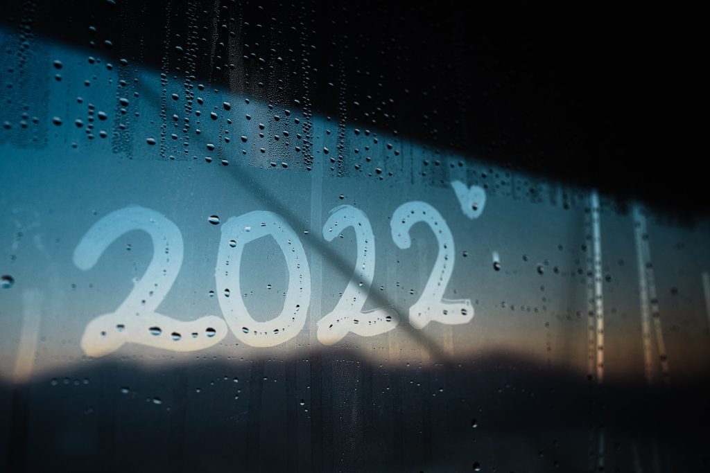 The letters 2022 are written on a steamy window, alongside a small love heart.