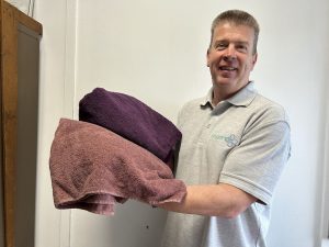 Paul Hamilton with dyed towels